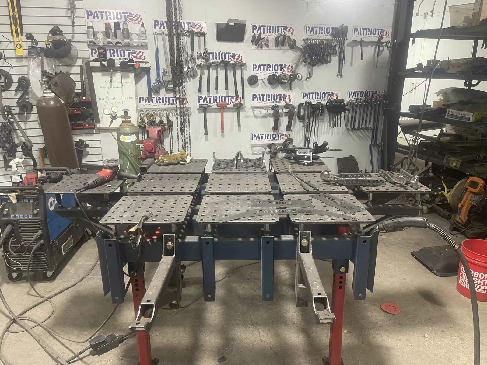 Patriot Chassis fabrication shop with welding fixtures and chassis jig table